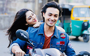 A still ft. the lead pair of `LoveYatri: A Journey of Love` on a scooter